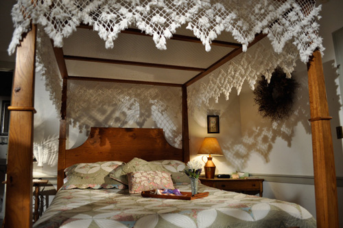 Hand knotted lace canopy over queen size bed at the Jean Bonnet B&B, Bedford, PA 