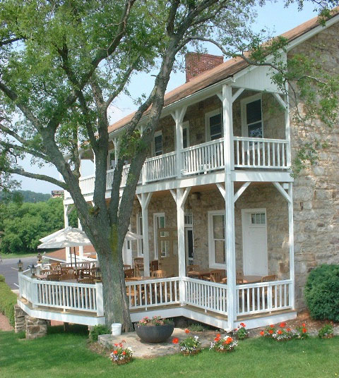 View of dining tables on extended porch at Jean Bonnet Tavern, Bedford, PA